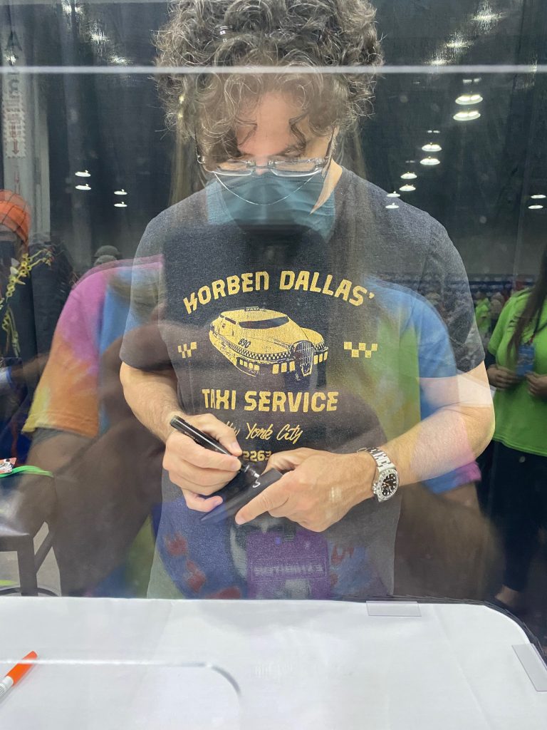 Sean Schemmel at Cincinnati ComicCon signing a horn from Frieza